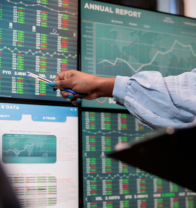 Close Up Shot Of Financial Advisor Pointing Out Downtrend Of Market While Reviewing Real Time Trading Data. Close Up Shot Of Financial Advisor Pointing Out Downtrend Of Market While Reviewing Real Time Trading Data.